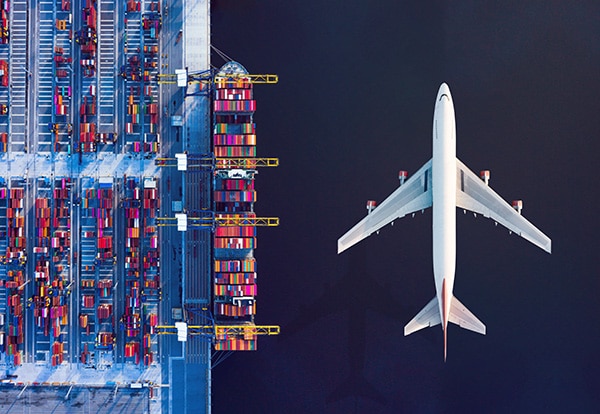 airplane shipping international logistics above ocean containers