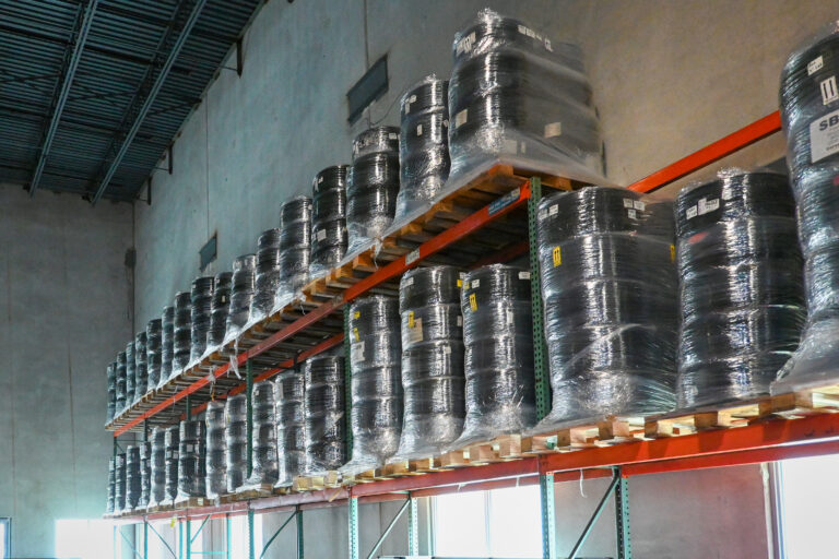 racing tires on racks ready to ship