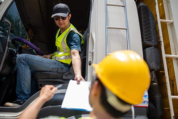 customs agent inspecting driver